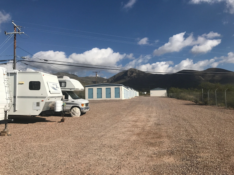 RV and storage units under blue sky